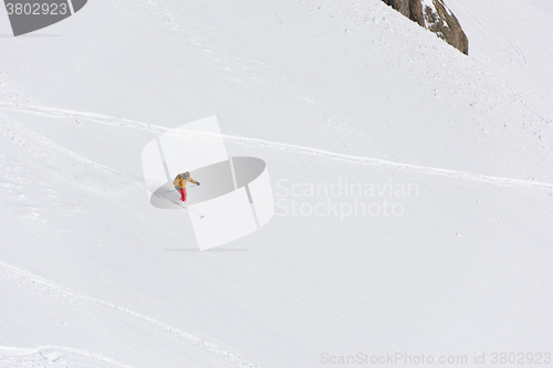 Image of freeride skier skiing in deep powder snow