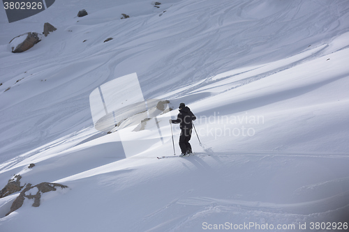 Image of freeride skier skiing in deep powder snow