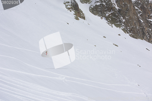 Image of freeride skier skiing in deep powder snow