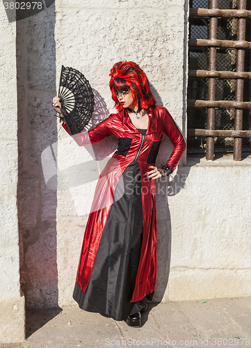 Image of Disguised Woman with a Fan - Venice Carnival 2012