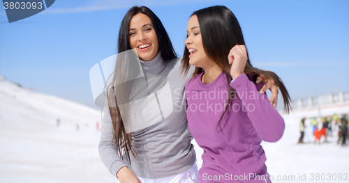 Image of Laughing vivacious young women at a ski resort