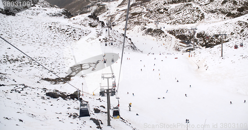 Image of View from a ski lift of skiers below on run