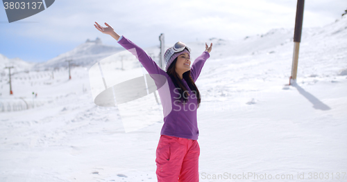 Image of Happy young woman celebrating her winter vacation