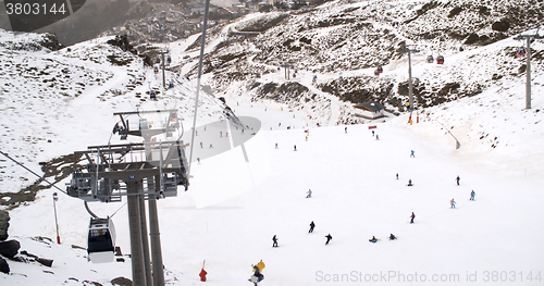 Image of View from a ski lift of skiers below on run