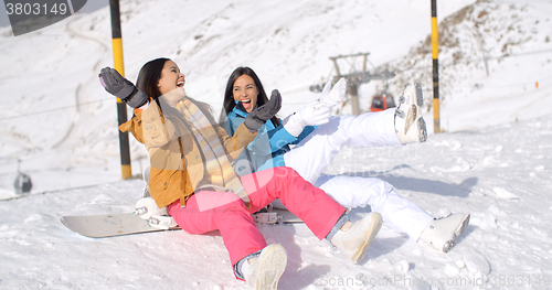Image of Two happy young women enjoying a winter holiday