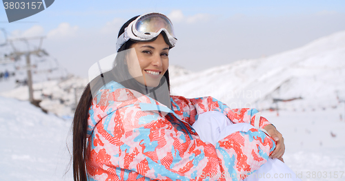 Image of Gorgeous young woman in ski clothes and goggles