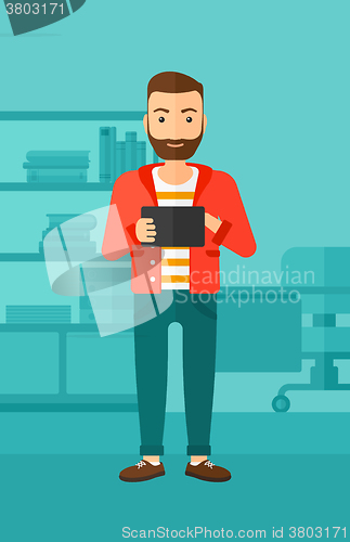 Image of Man using tablet computer.