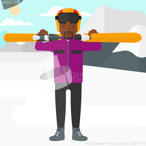 Image of Man holding skis.