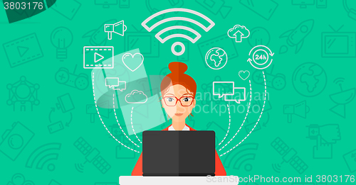 Image of Woman working on laptop.