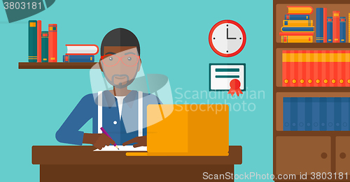 Image of Man using laptop for education.