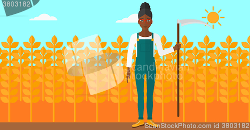 Image of Farmer on the field with scythe.