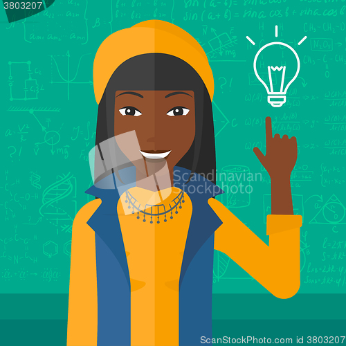 Image of Woman pointing at light bulb.