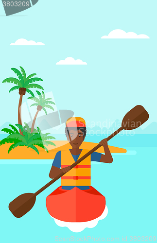 Image of Man riding in canoe.