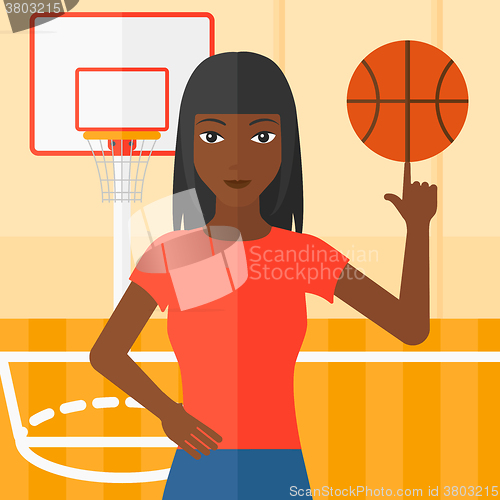 Image of Basketball player spinning ball.