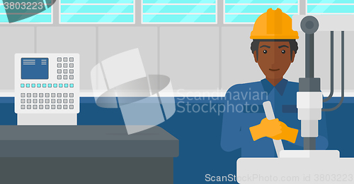 Image of Man working with industrial equipment.