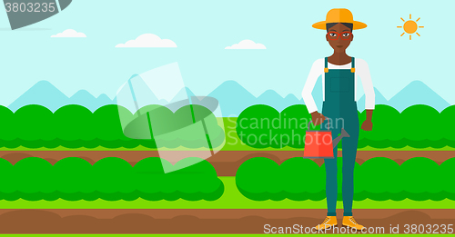 Image of Farmer with watering can.