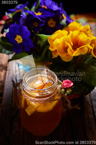 Image of Ginger tea with orange, spices and honey.