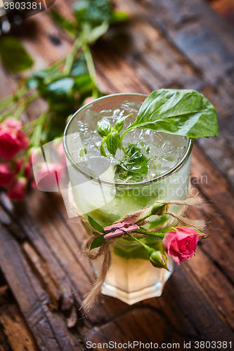 Image of fresh mojito on a rustic table