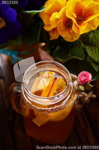 Image of Ginger tea with orange, spices and honey.