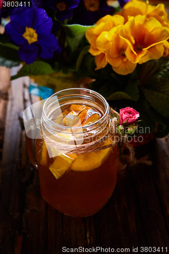 Image of Ginger tea with orange, spices and honey.