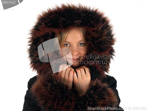 Image of Smiling winter girl with a fur hood