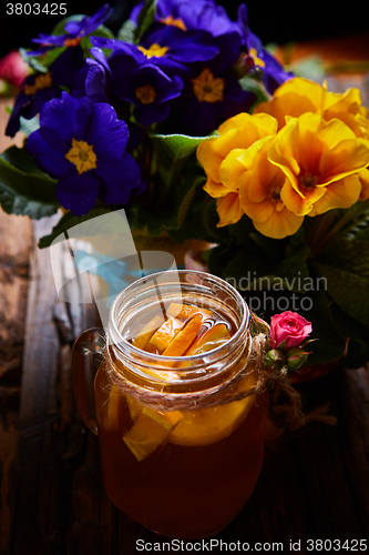 Image of Ginger tea with orange, spices and honey.