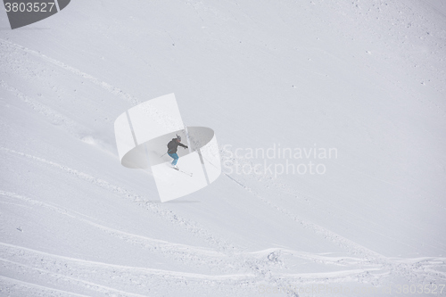 Image of freeride skier skiing in deep powder snow