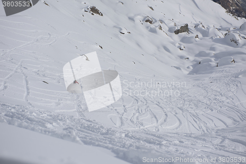 Image of freeride skier skiing in deep powder snow