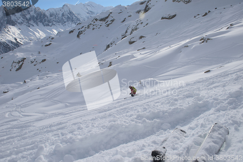 Image of freeride skier skiing in deep powder snow