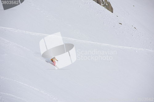 Image of freeride skier skiing in deep powder snow