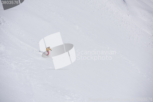 Image of freeride skier skiing in deep powder snow