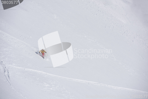 Image of freeride skier skiing in deep powder snow