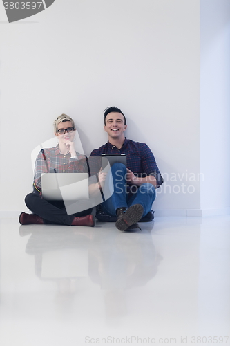 Image of startup business, couple working on laptop computer at office