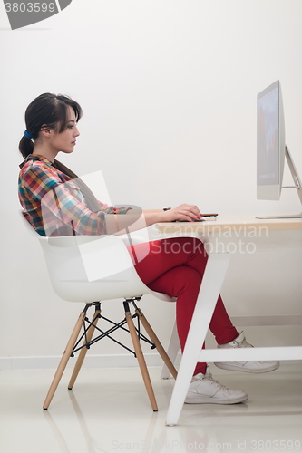 Image of startup business, woman  working on desktop computer