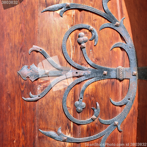 Image of detail of metallic handmade work on old door