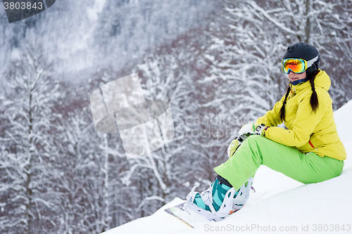 Image of Portrait of snowboarder woman