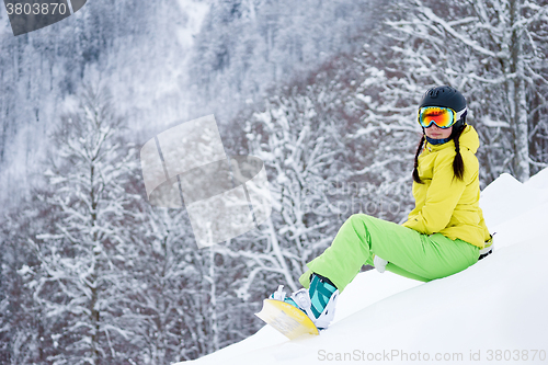 Image of Portrait of snowboarder woman