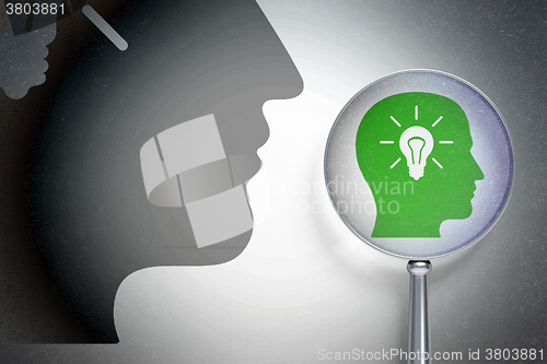 Image of Information concept:  Head With Light Bulb with optical glass on digital background