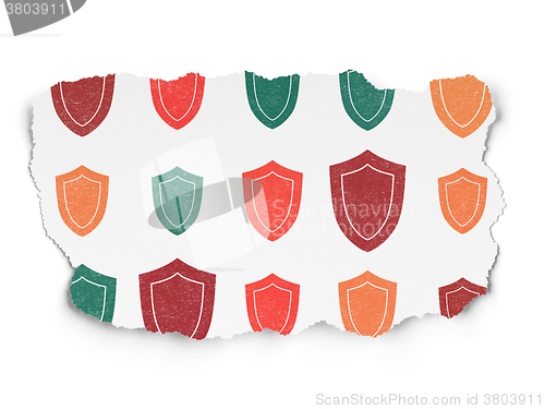 Image of Safety concept: Shield icons on Torn Paper background