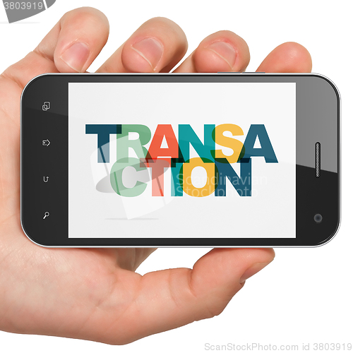 Image of Banking concept: Hand Holding Smartphone with Transaction on  display