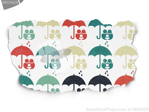 Image of Safety concept: Family And Umbrella icons on Torn Paper background