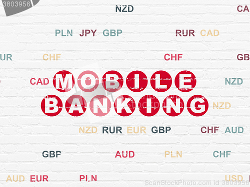Image of Currency concept: Mobile Banking on wall background