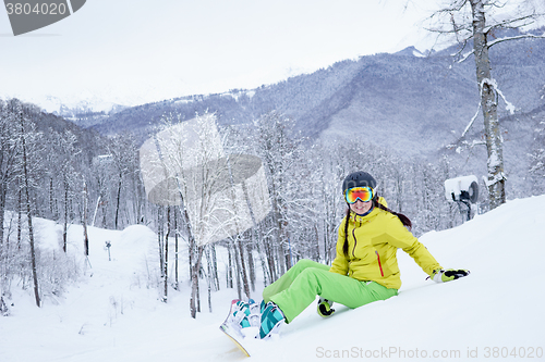 Image of Portrait of snowboarder woman.