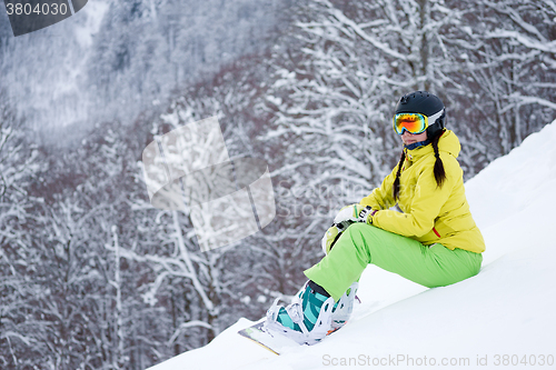 Image of Portrait of snowboarder woman