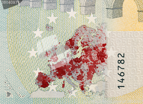 Image of Close-up of a 5 euro bank note, stained with blood