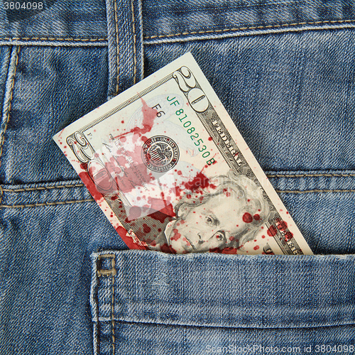 Image of Macro shot of trendy jeans with american 20 dollar bill, blood