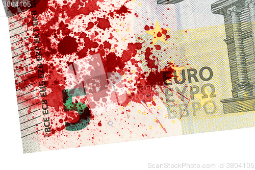 Image of Close-up of a 5 euro bank note, stained with blood