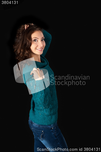Image of Attractive red-haired woman in sweater