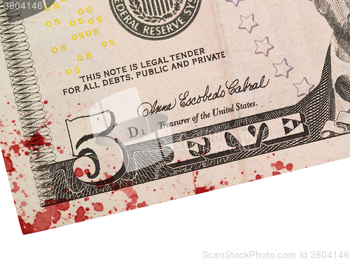 Image of US five Dollar bill, close up, blood