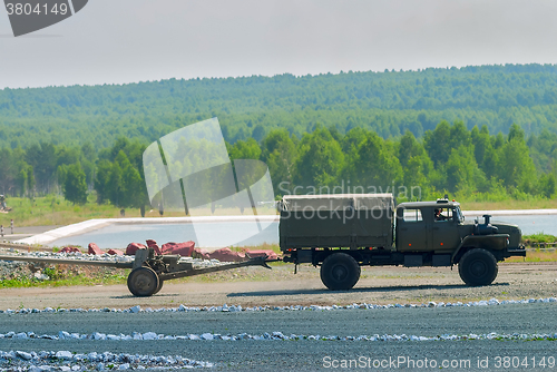 Image of army truck transports a gun